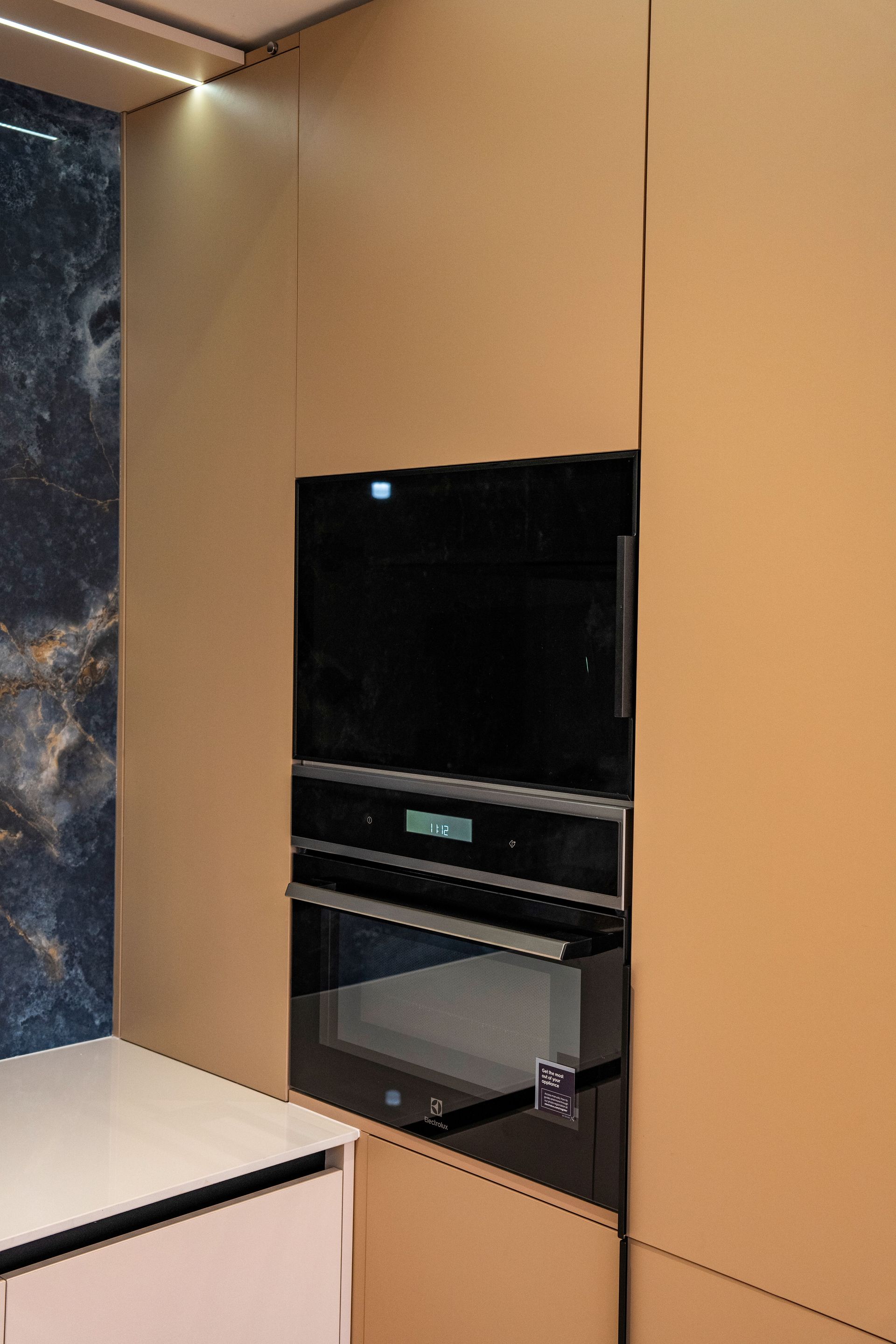 Sleek built-in oven in a modern kitchen setting featuring minimalist design.